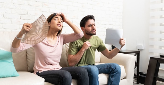 couple who is hot in their home